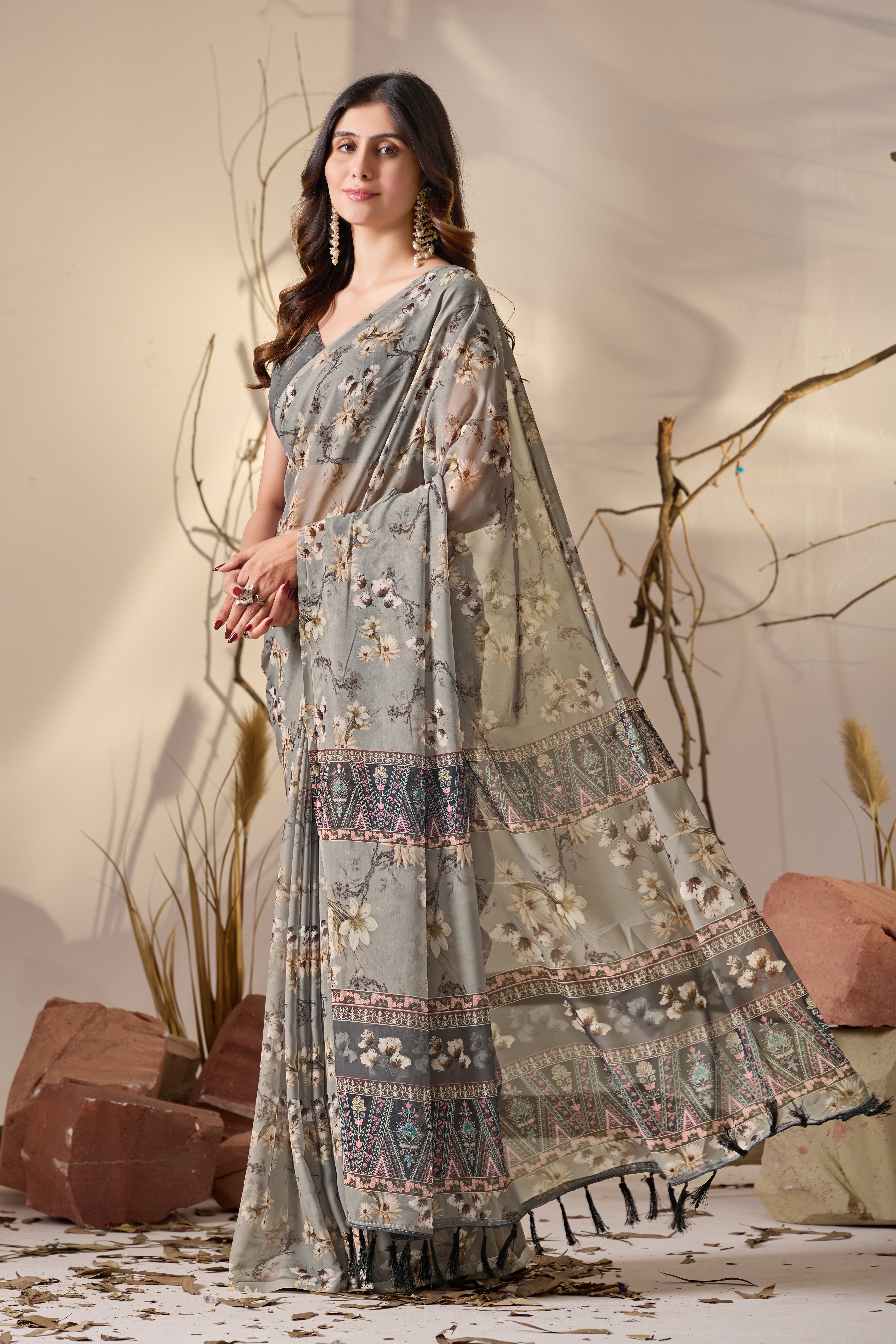 Soft Georgette Saree in Muted Grey Base Adorned with All-Over Floral Digital Print and Enhanced with Ornate Tribal-Style Patterned Pallu Featuring Pink