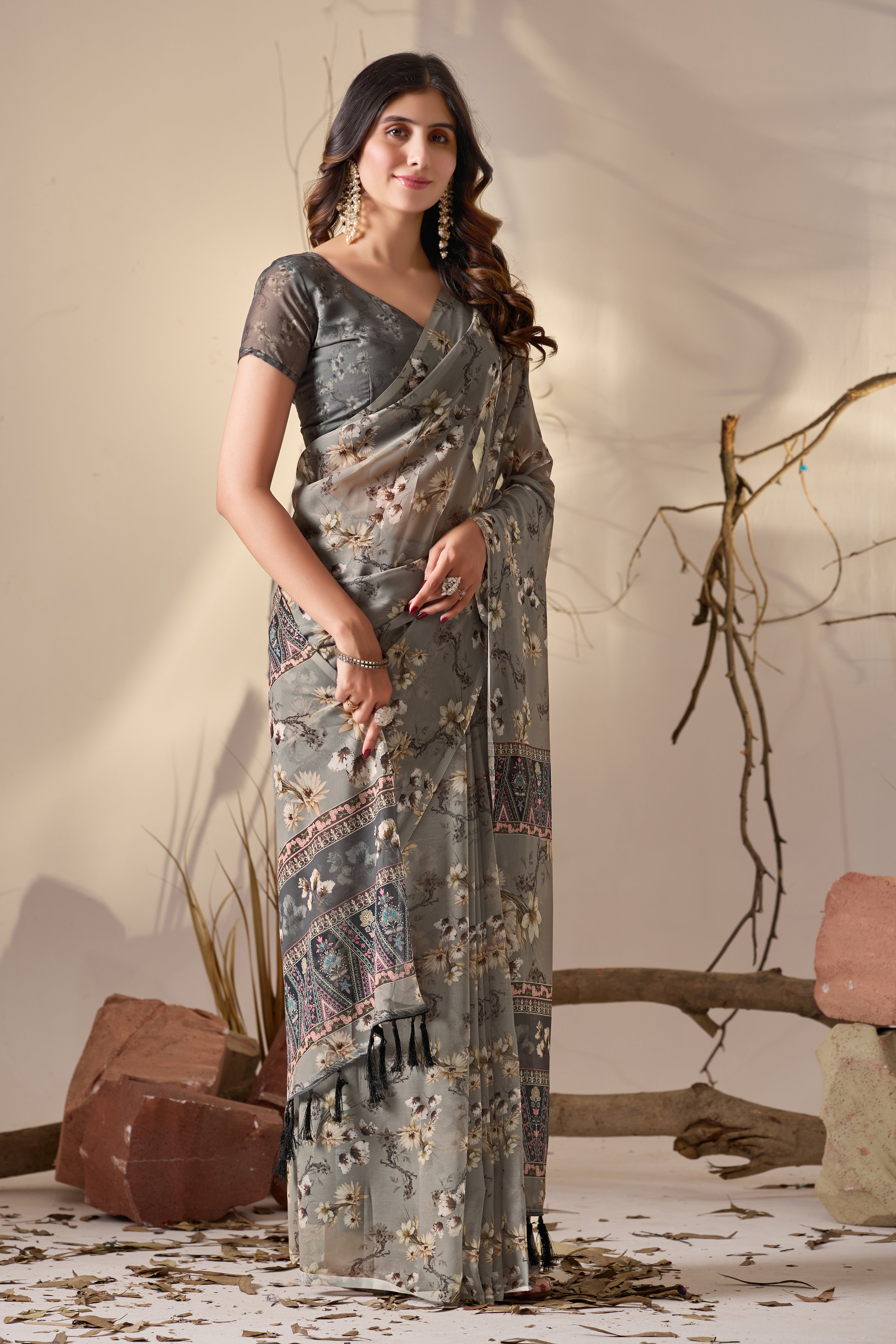 Soft Georgette Saree in Muted Grey Base Adorned with All-Over Floral Digital Print and Enhanced with Ornate Tribal-Style Patterned Pallu Featuring Pink