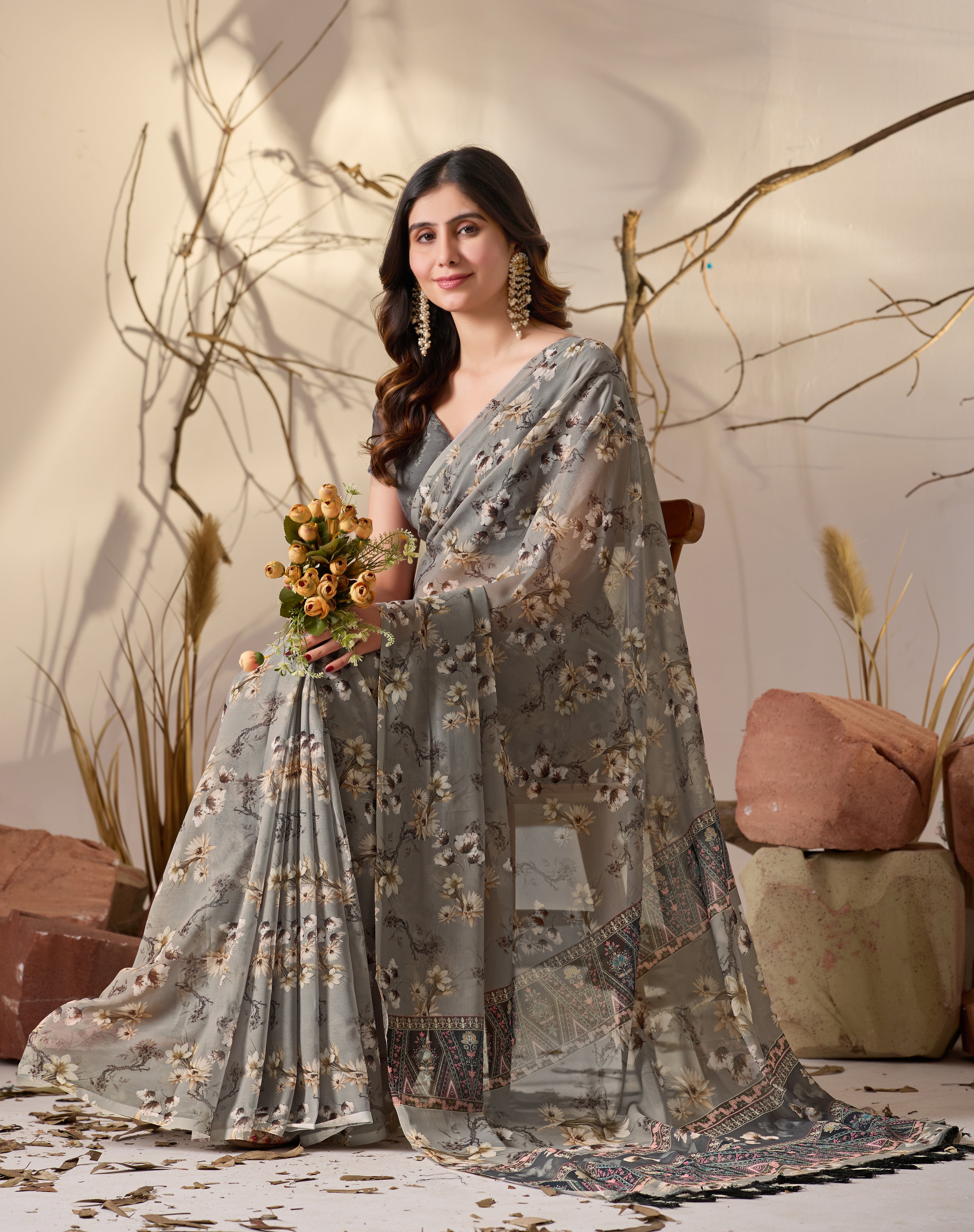 Soft Georgette Saree in Muted Grey Base Adorned with All-Over Floral Digital Print and Enhanced with Ornate Tribal-Style Patterned Pallu Featuring Pink