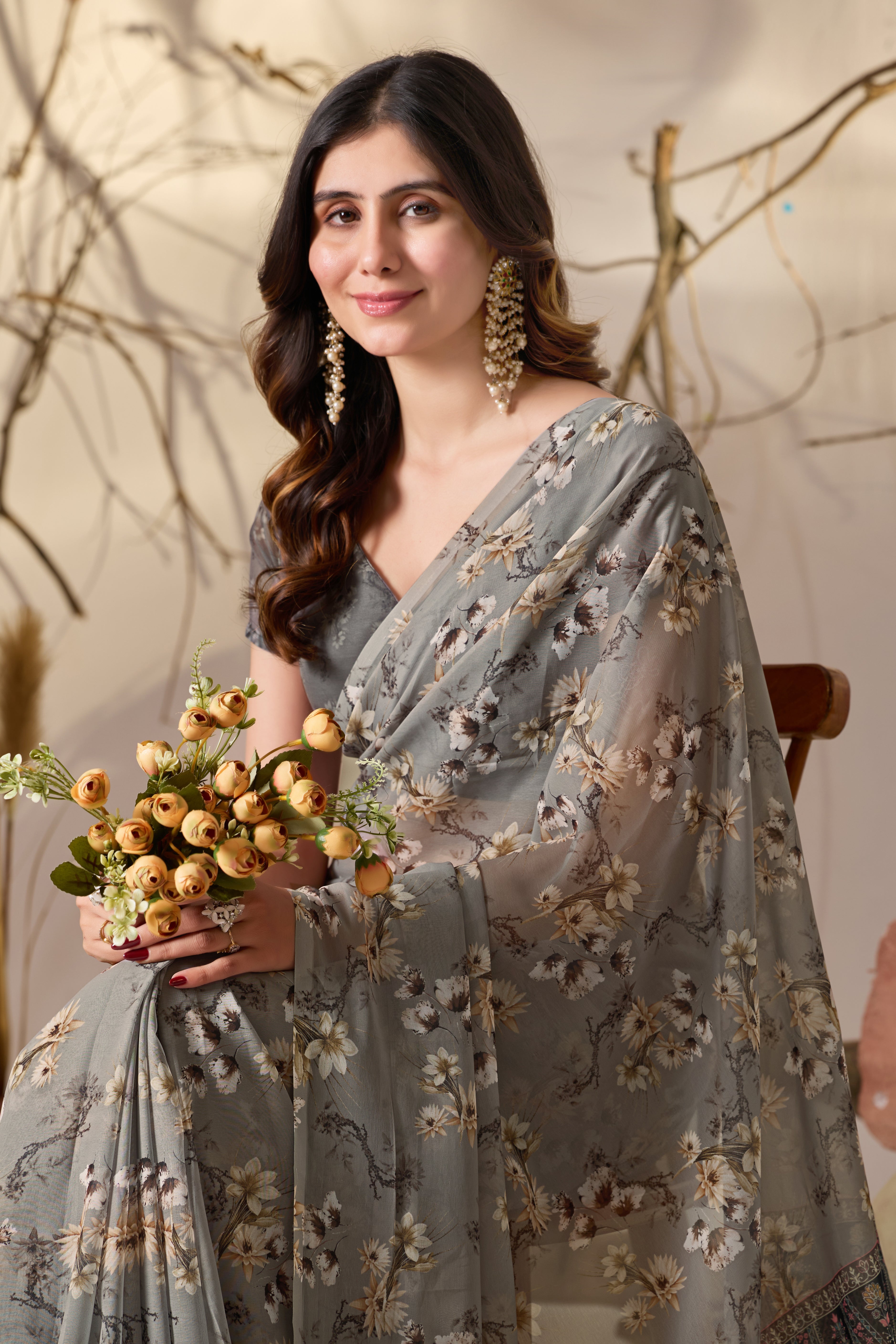 Soft Georgette Saree in Muted Grey Base Adorned with All-Over Floral Digital Print and Enhanced with Ornate Tribal-Style Patterned Pallu Featuring Pink