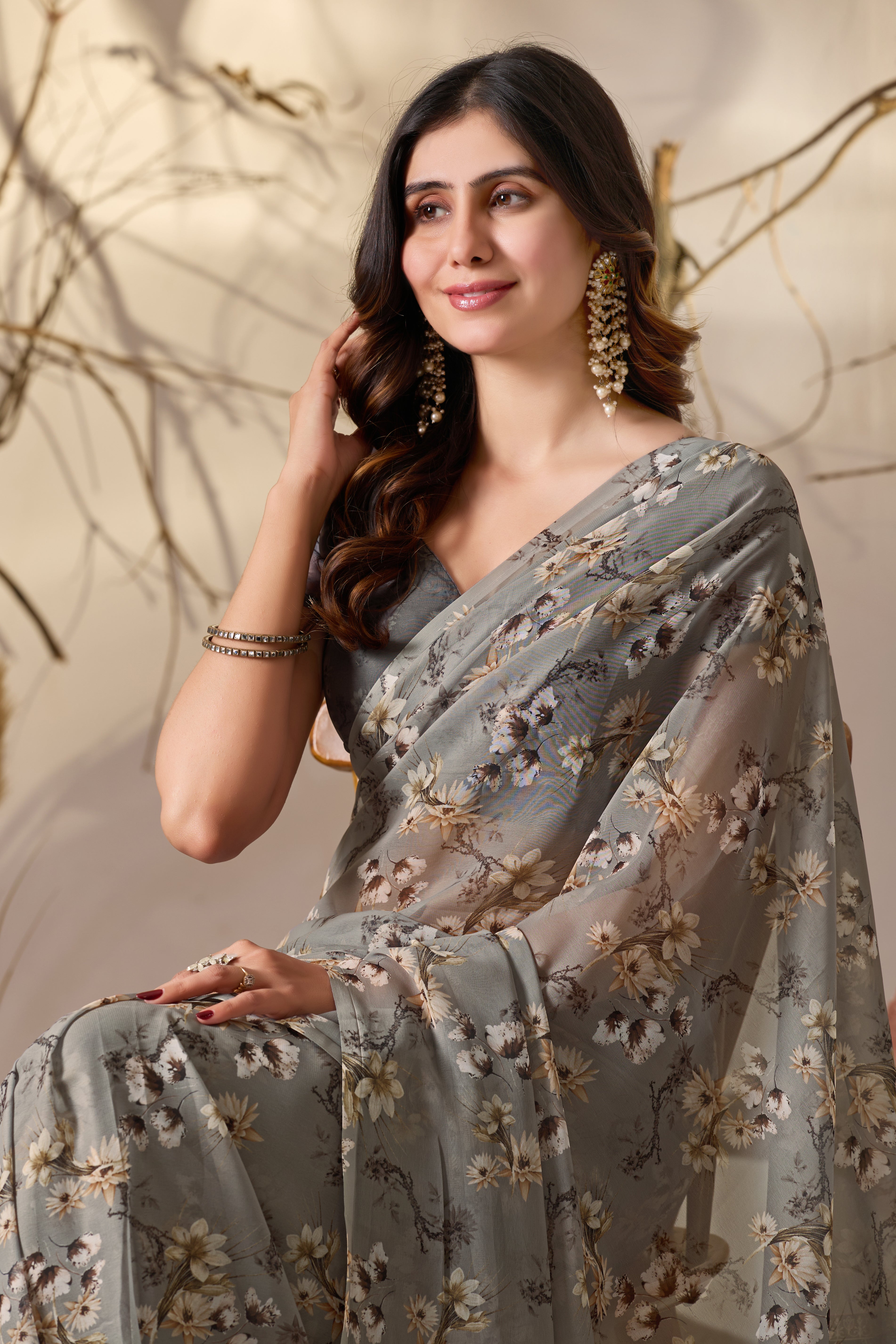 Soft Georgette Saree in Muted Grey Base Adorned with All-Over Floral Digital Print and Enhanced with Ornate Tribal-Style Patterned Pallu Featuring Pink