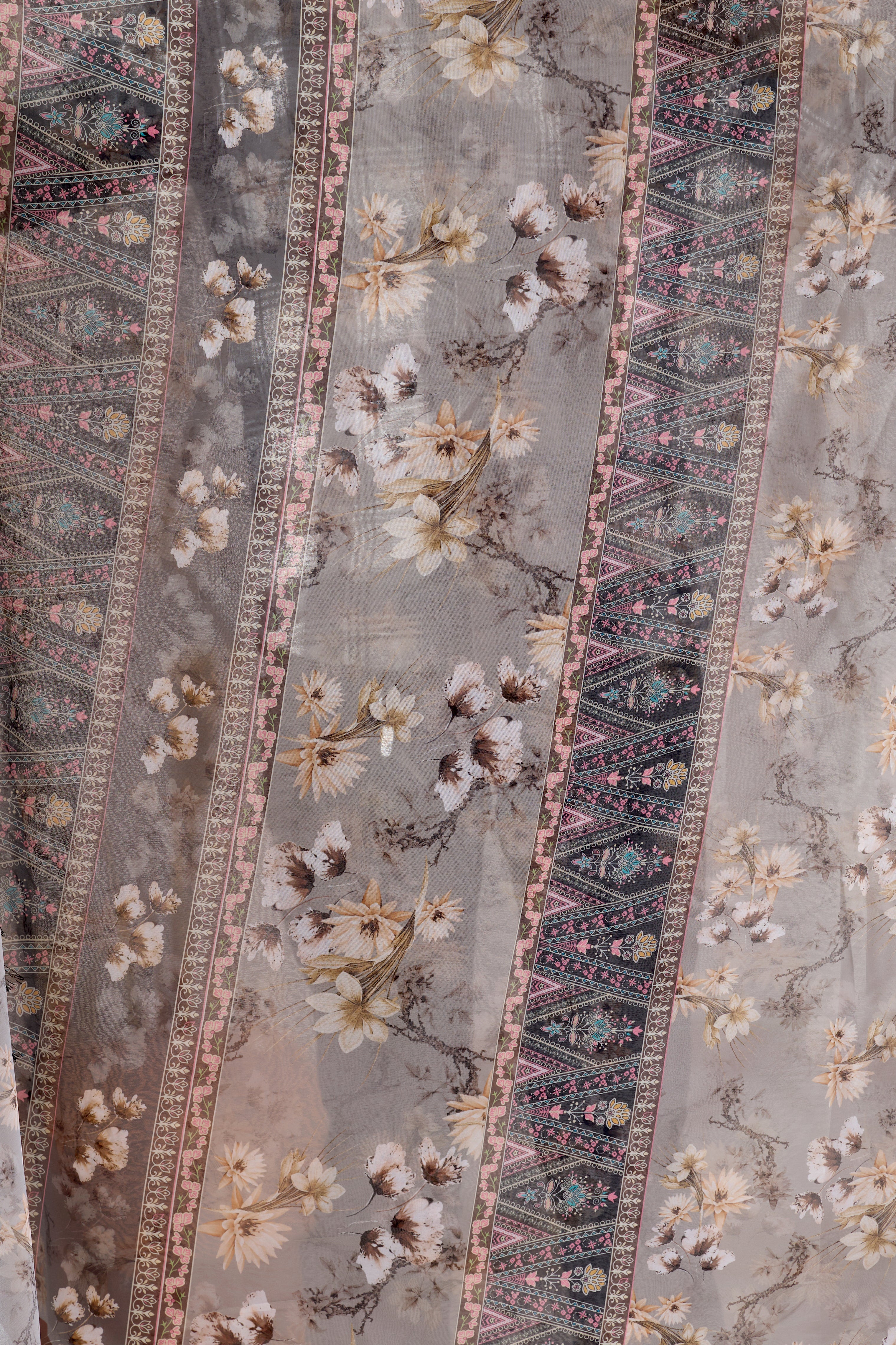 Soft Georgette Saree in Muted Grey Base Adorned with All-Over Floral Digital Print and Enhanced with Ornate Tribal-Style Patterned Pallu Featuring Pink