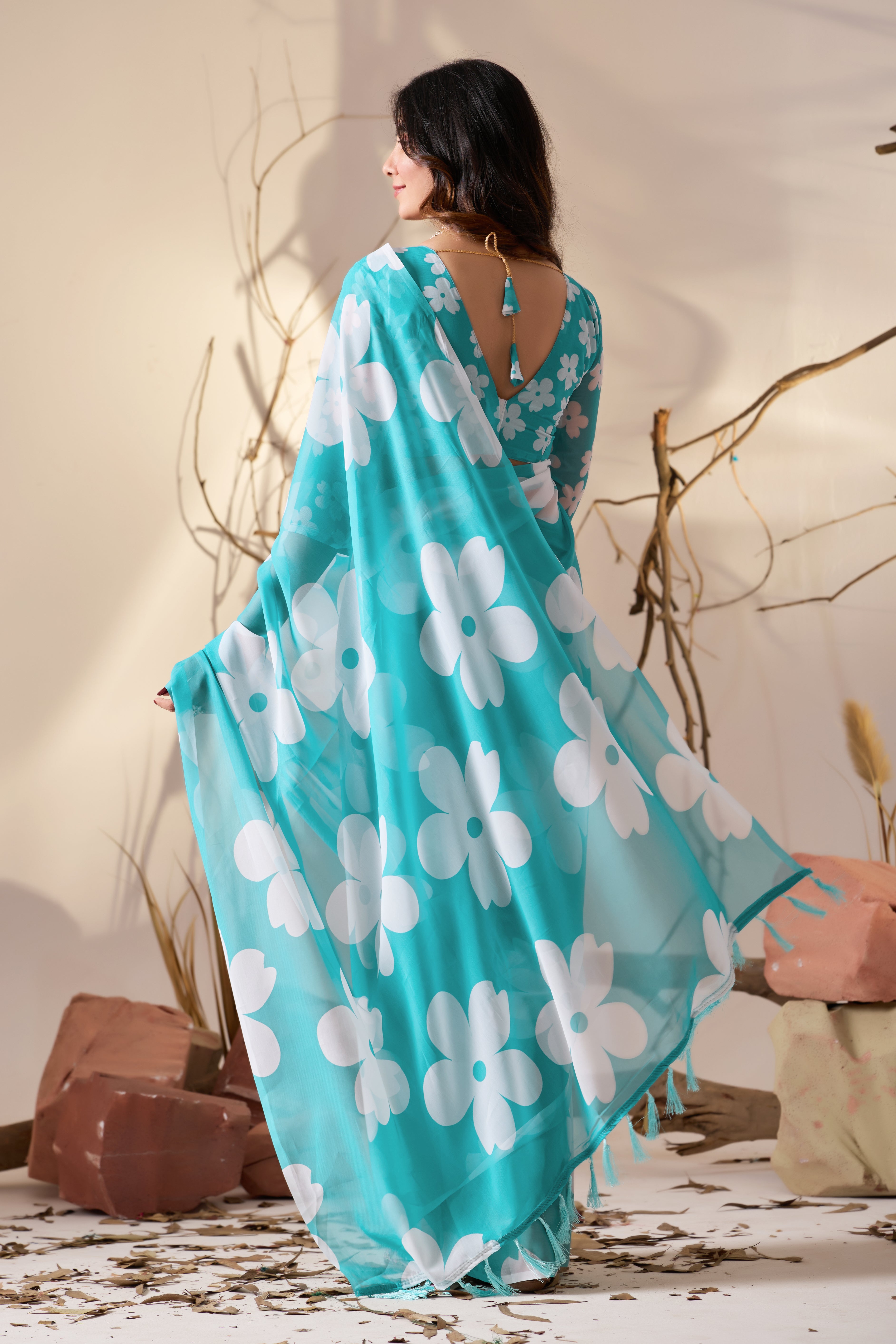 Soft Georgette Saree in Aqua Blue Shade Beautified with Bold White Oversized Floral Digital Print