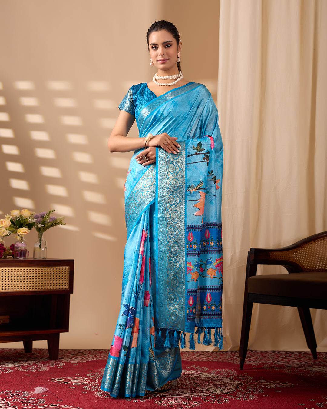Soft Lichi Silk Saree in Serene Sky Blue Tone adorned with mesmerizing lotus-inspired digital prints and complemented by a luxurious golden zari woven border