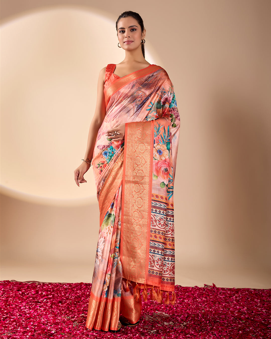 Soft Lichi Silk Saree adorned with elegant floral patterns and intricate Patola-inspired pallu, complemented by a luxurious zari woven border