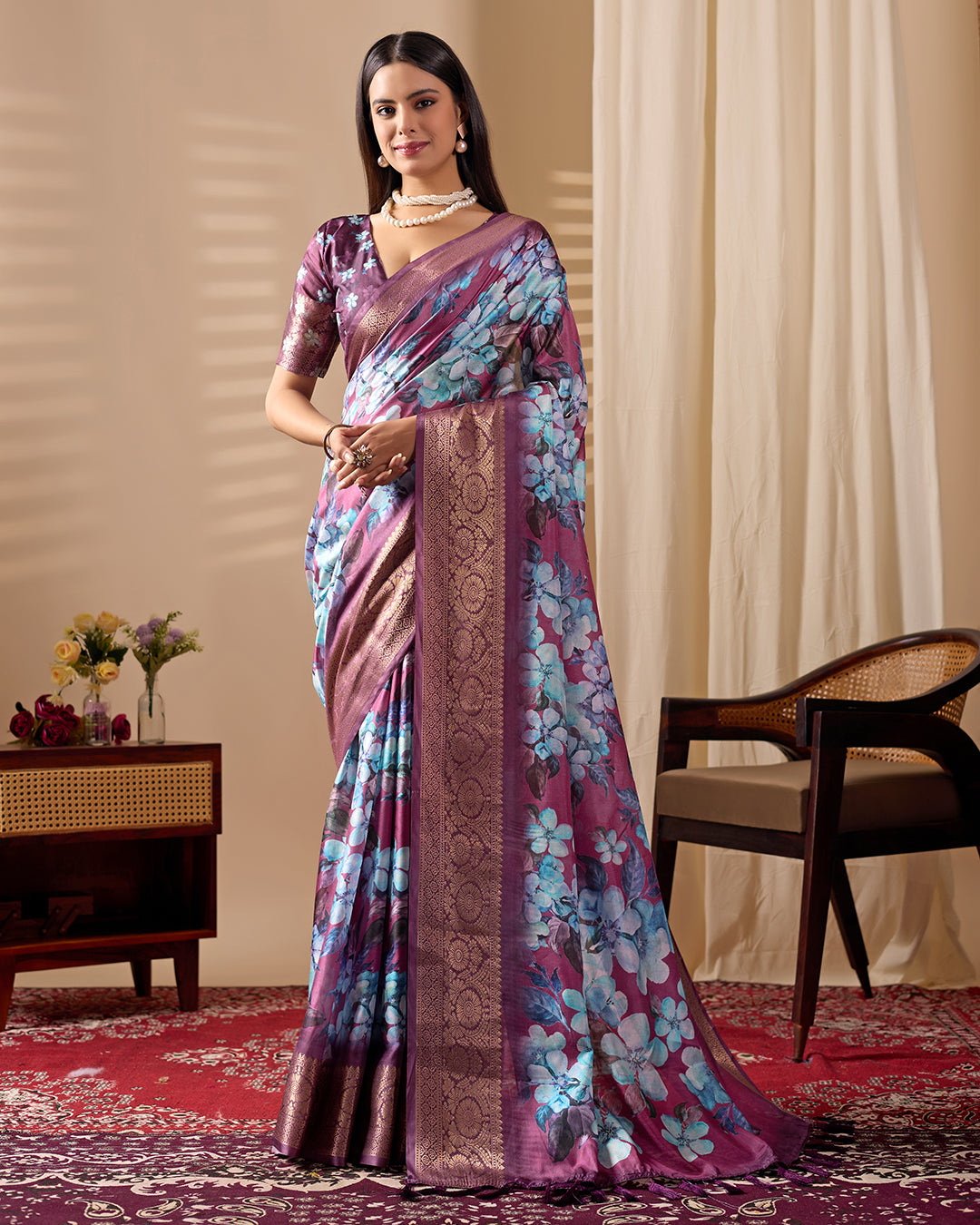Soft Lichi Silk Saree beautifully enhanced with large blooming floral prints and a rich zari woven border