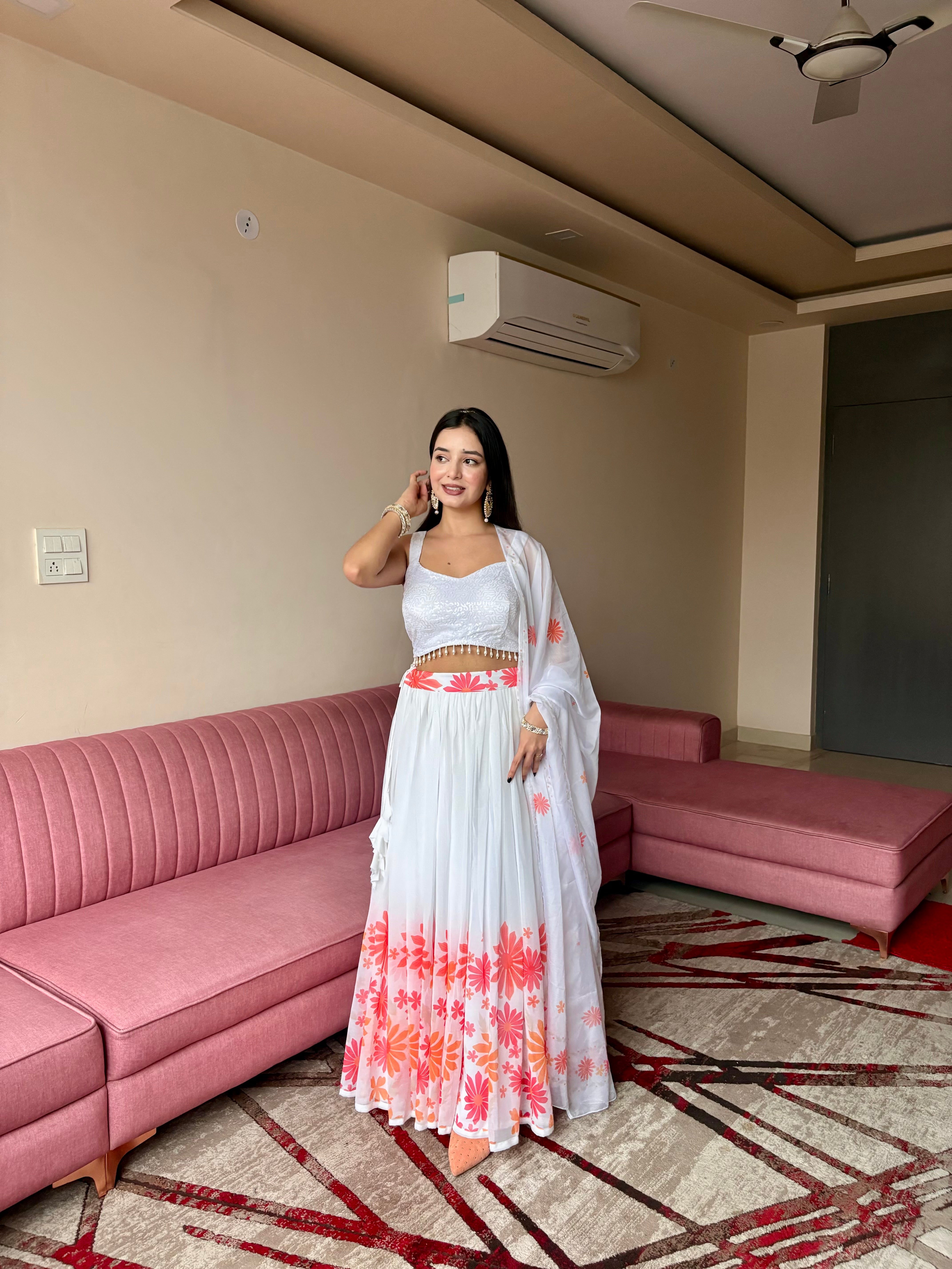 A swirl of white elegance kissed with coral floral magic