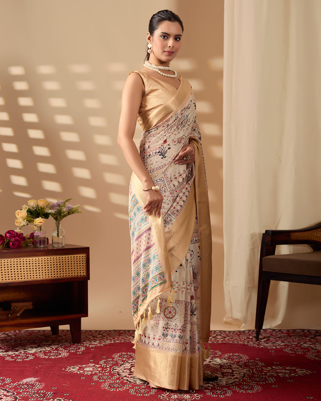 Soft Lichi Silk Saree adorned with graceful ethnic digital prints and complemented by a luxurious golden zari woven border
