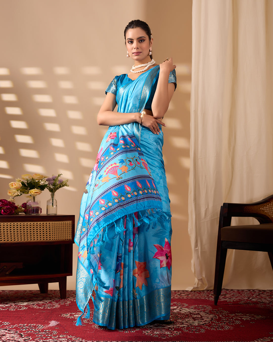 Soft Lichi Silk Saree in Serene Sky Blue Tone adorned with mesmerizing lotus-inspired digital prints and complemented by a luxurious golden zari woven border