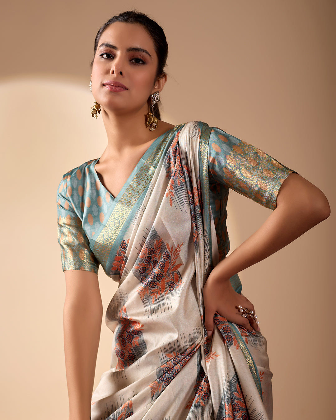 Elegant Soft Lichi Silk Saree in a refined ivory and teal tone, featuring traditional motifs and intricate digital prints enhanced with a golden zari border