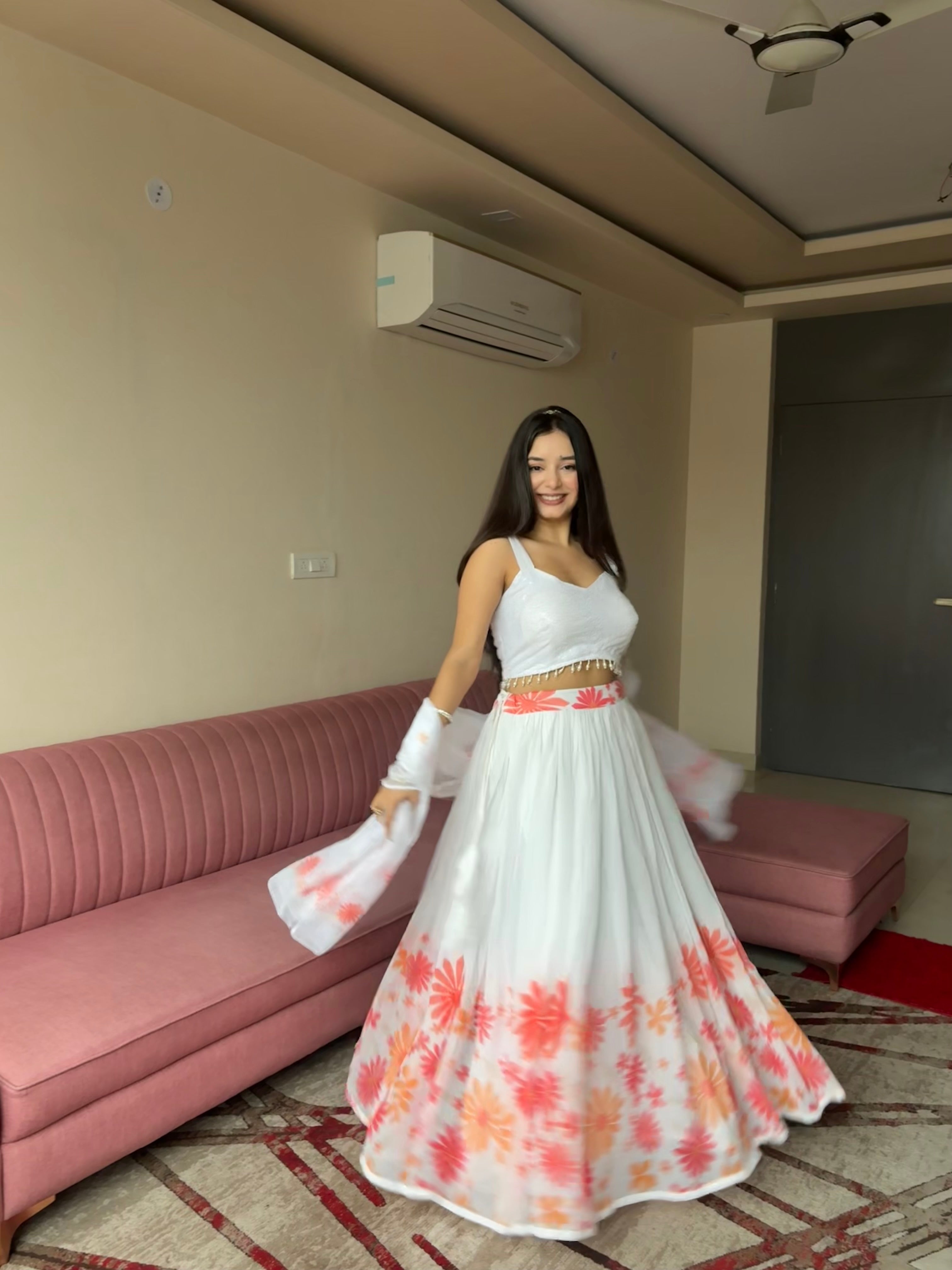 A swirl of white elegance kissed with coral floral magic