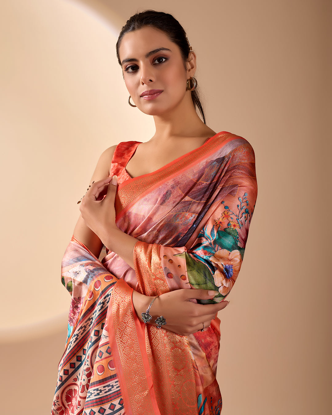 Soft Lichi Silk Saree adorned with elegant floral patterns and intricate Patola-inspired pallu, complemented by a luxurious zari woven border