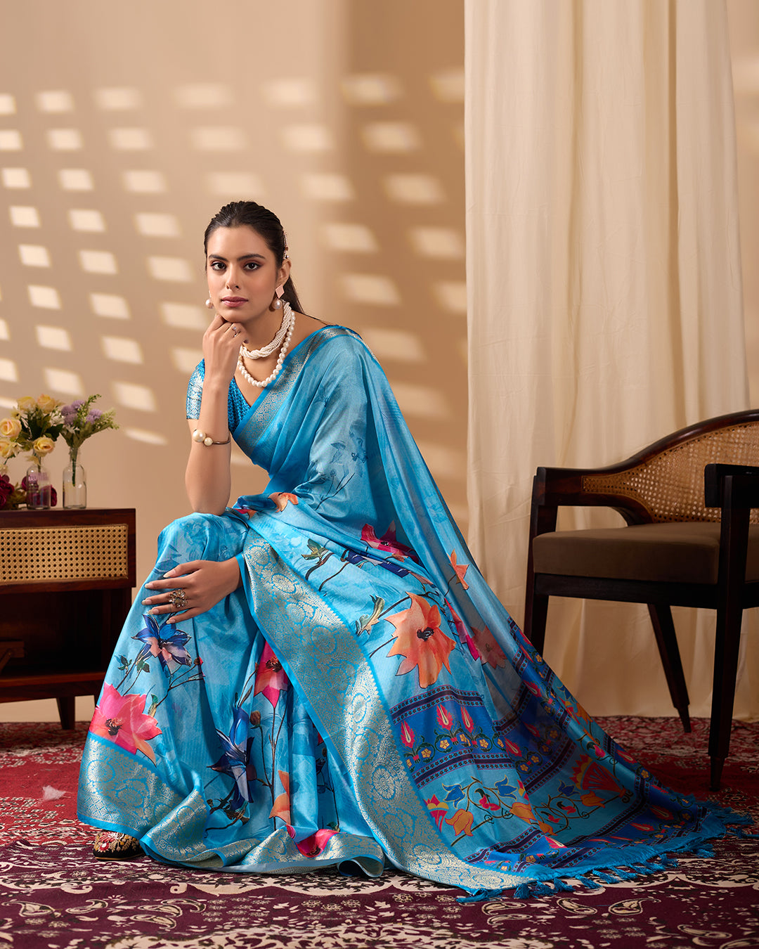 Soft Lichi Silk Saree in Serene Sky Blue Tone adorned with mesmerizing lotus-inspired digital prints and complemented by a luxurious golden zari woven border