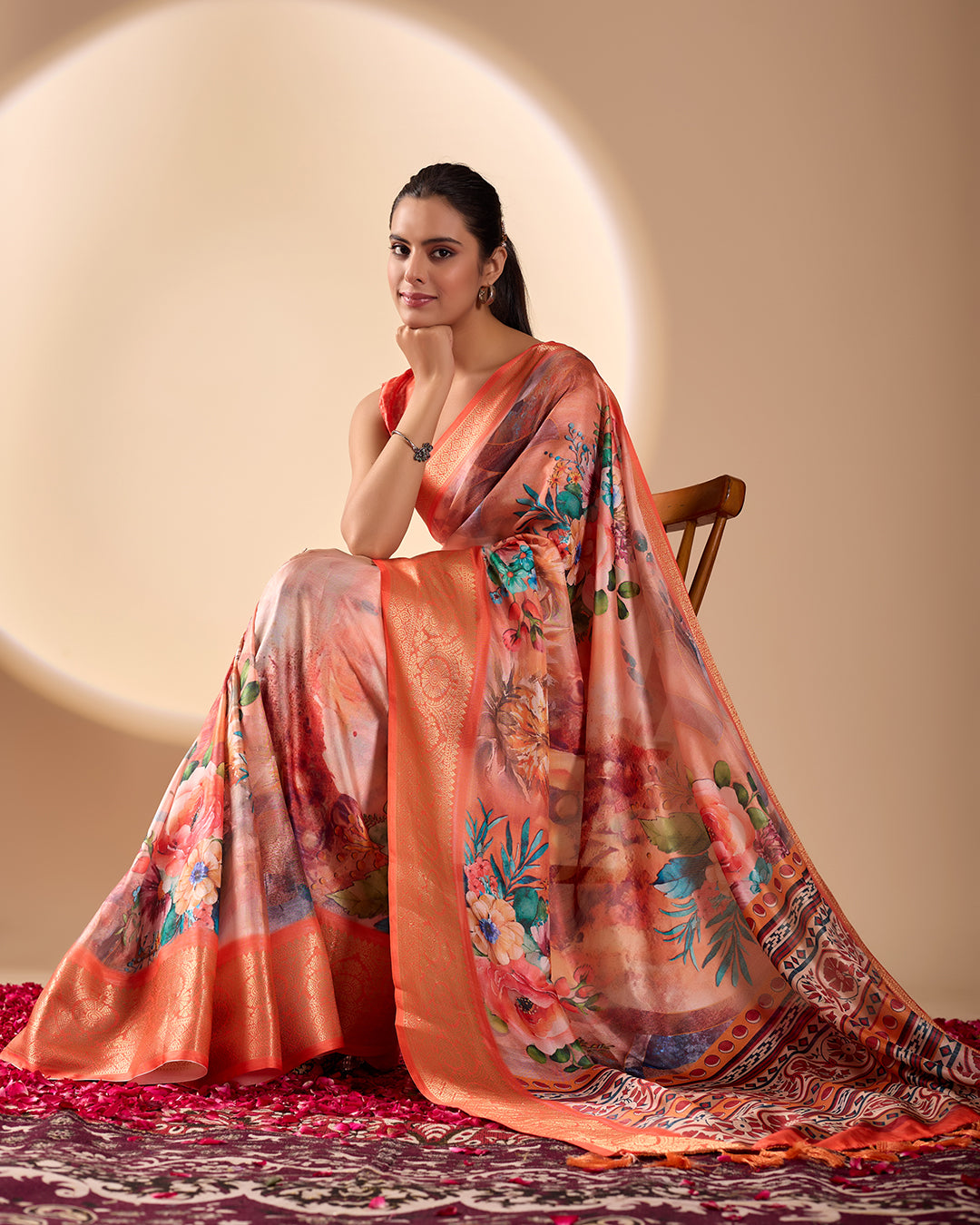 Soft Lichi Silk Saree adorned with elegant floral patterns and intricate Patola-inspired pallu, complemented by a luxurious zari woven border
