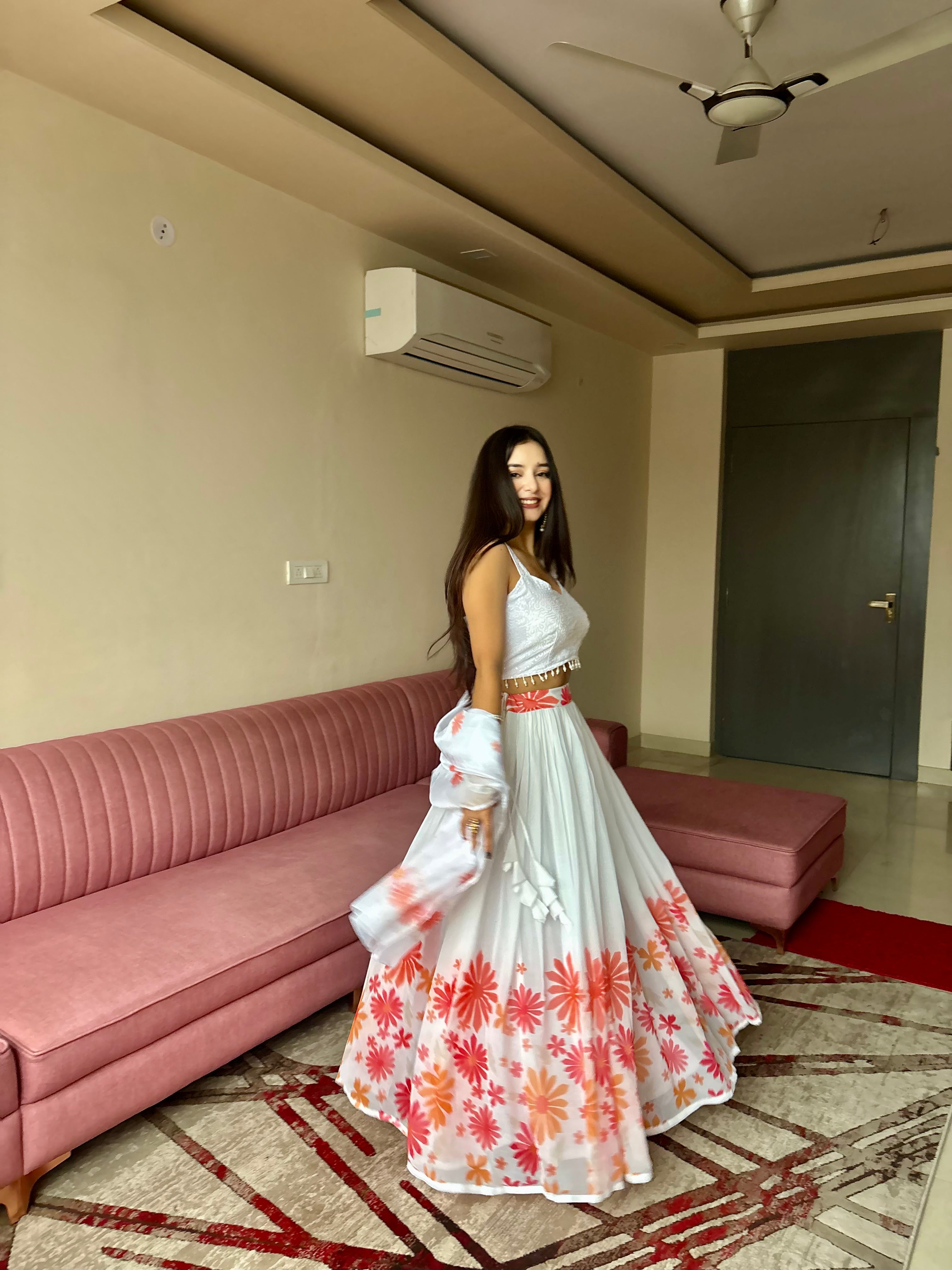 A swirl of white elegance kissed with coral floral magic