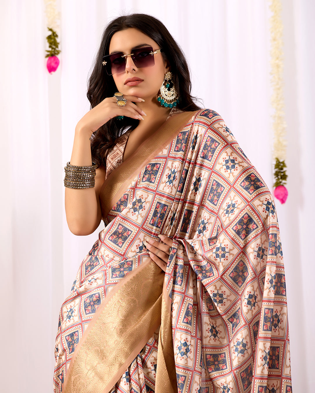 Premium Soft Lichi Silk Saree featuring elegant traditional geometric patterns, beautifully enhanced with a luxurious golden zari woven border