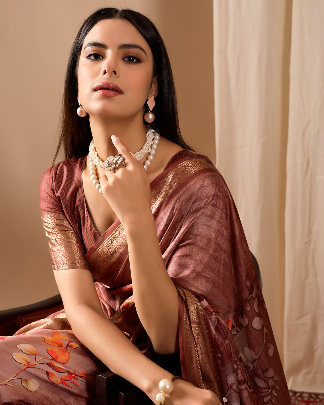 Soft Lichi Silk Saree adorned with graceful Patola-inspired motifs and a rich woven border