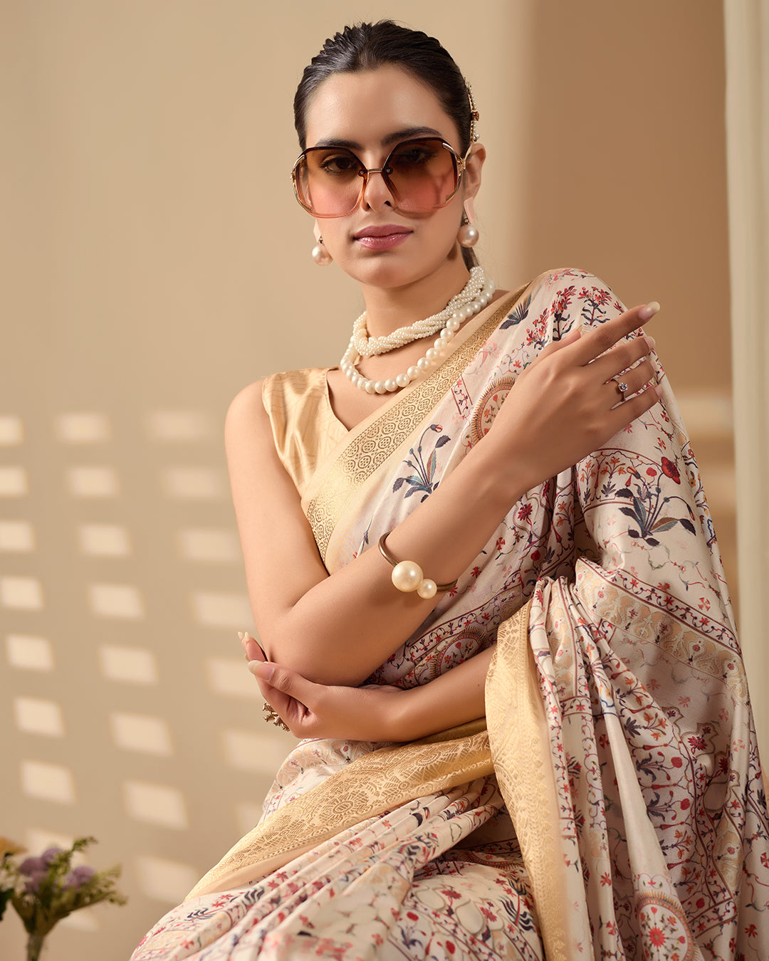 Soft Lichi Silk Saree adorned with graceful ethnic digital prints and complemented by a luxurious golden zari woven border