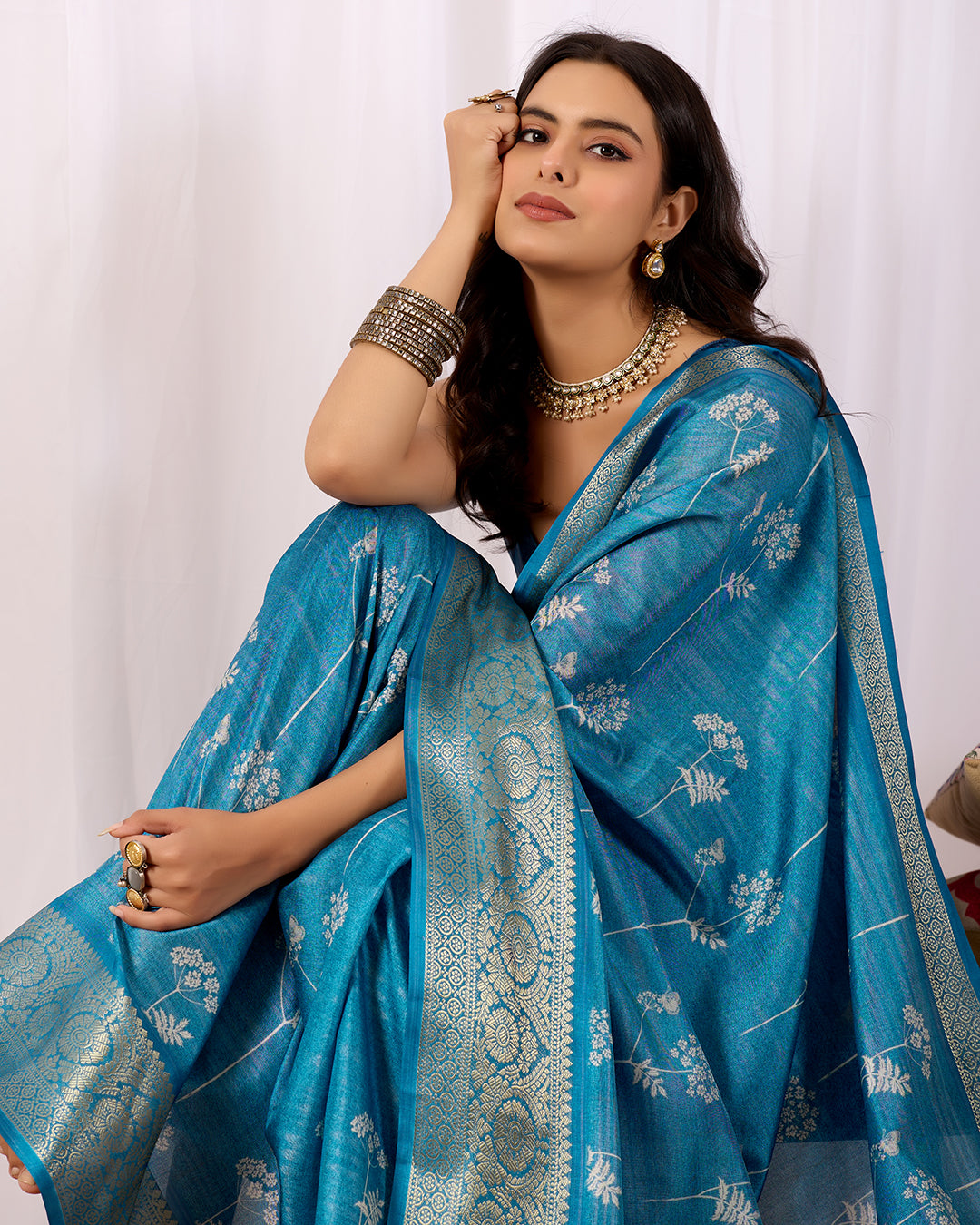 Premium Soft Lichi Silk Saree highlighted with graceful silver zari weaving and intricate ethnic motifs
