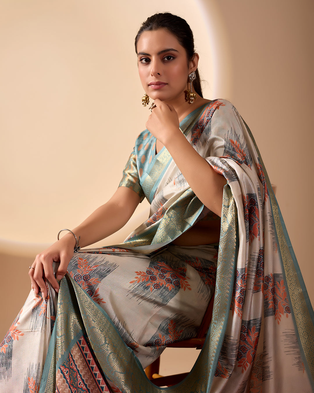 Elegant Soft Lichi Silk Saree in a refined ivory and teal tone, featuring traditional motifs and intricate digital prints enhanced with a golden zari border