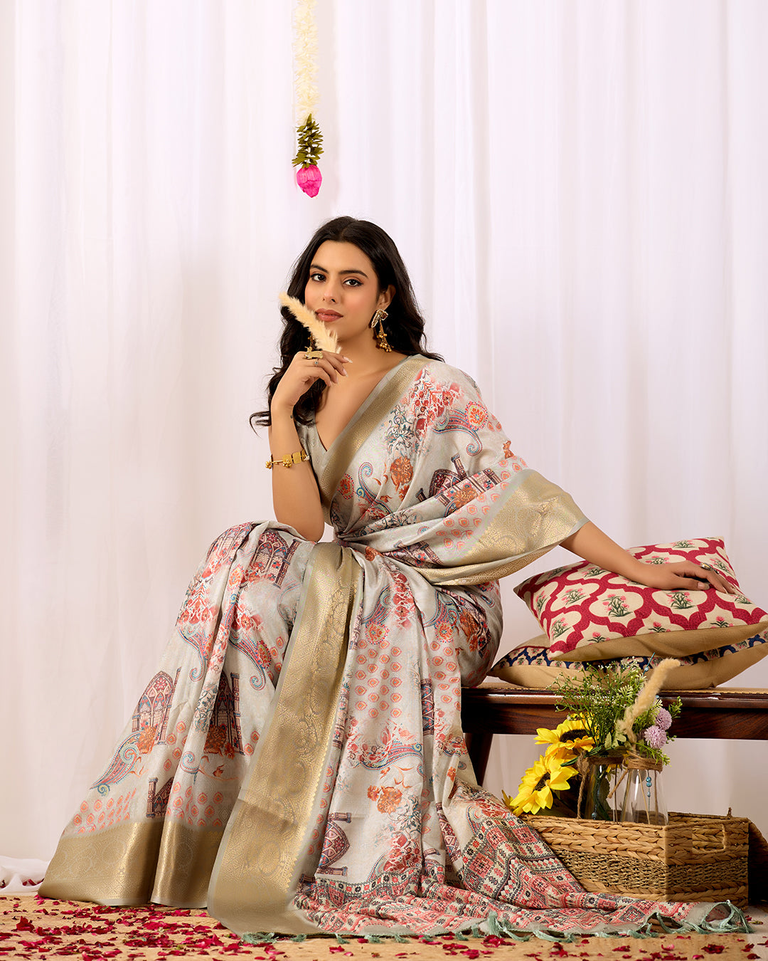 Elegant Soft Lichi Silk Saree featuring royal ethnic motifs with a lavish golden zari woven border