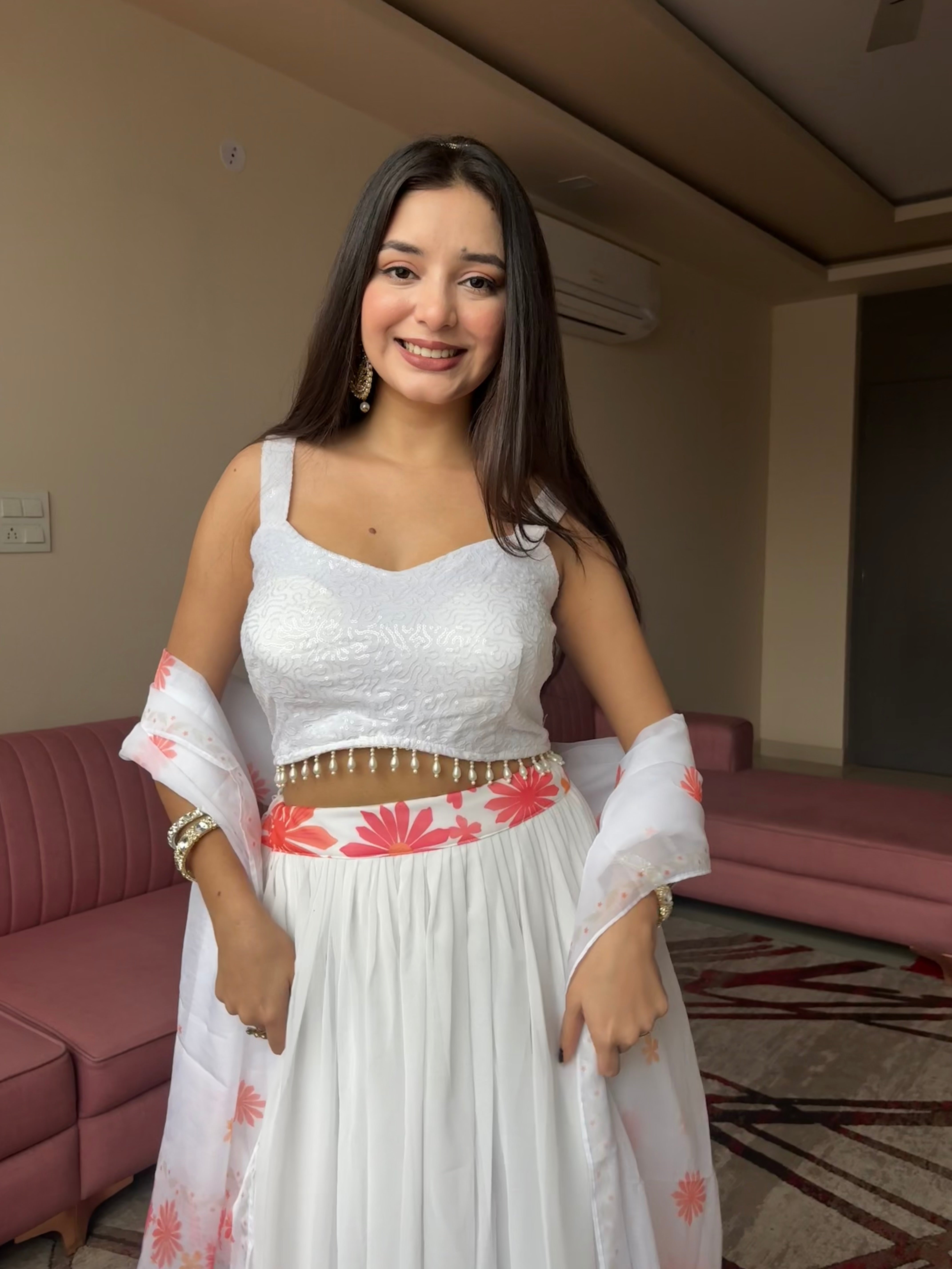 A swirl of white elegance kissed with coral floral magic