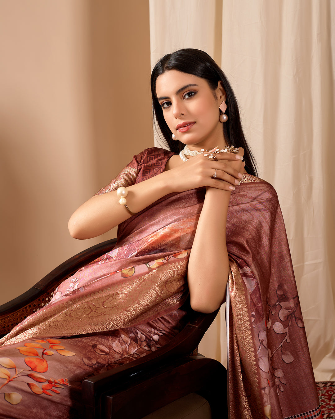 Soft Lichi Silk Saree adorned with graceful Patola-inspired motifs and a rich woven border