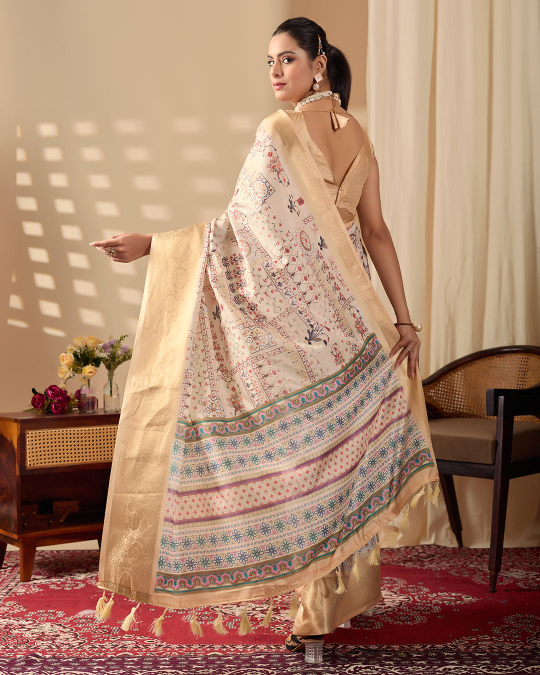 Soft Lichi Silk Saree adorned with graceful ethnic digital prints and complemented by a luxurious golden zari woven border
