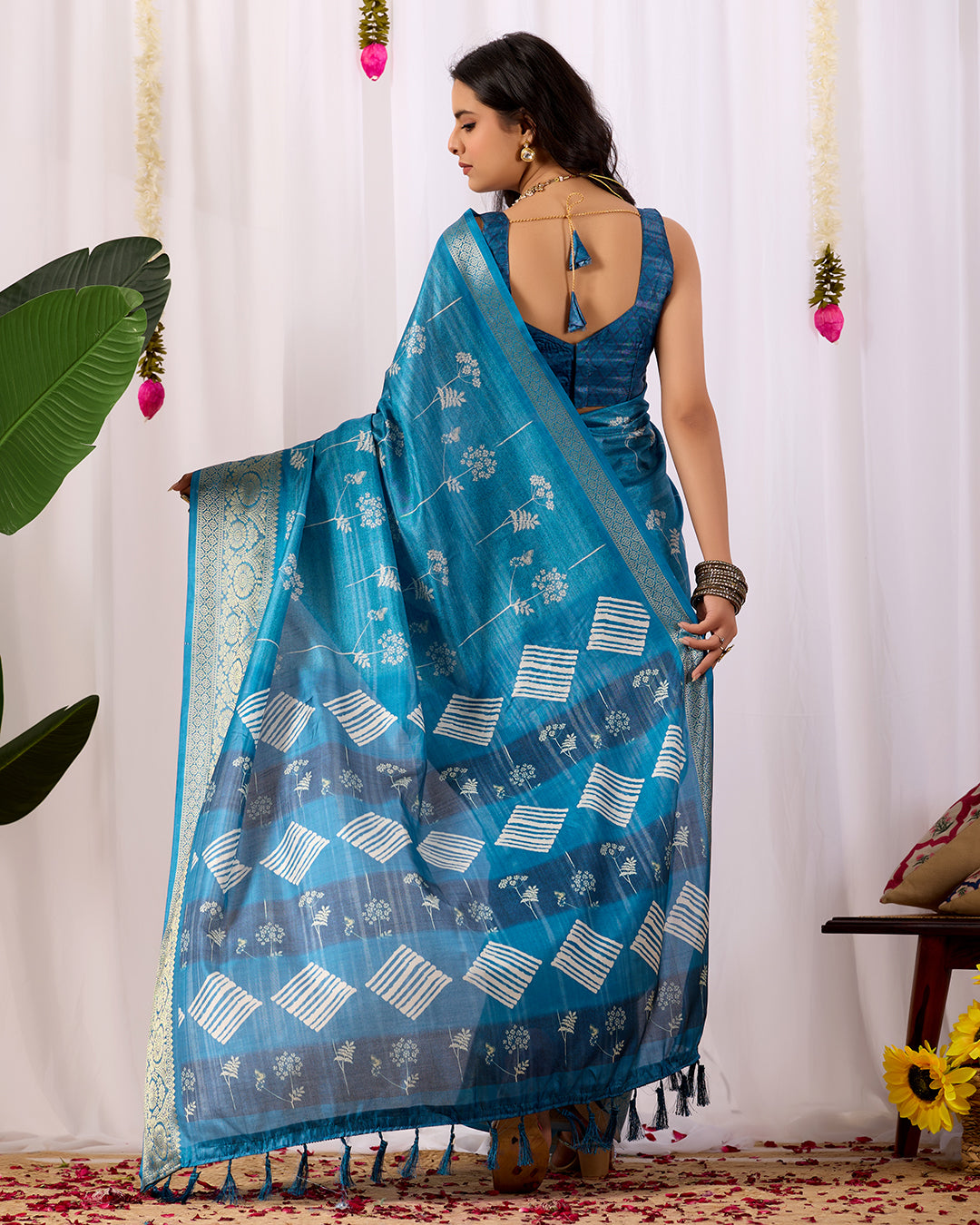 Premium Soft Lichi Silk Saree highlighted with graceful silver zari weaving and intricate ethnic motifs