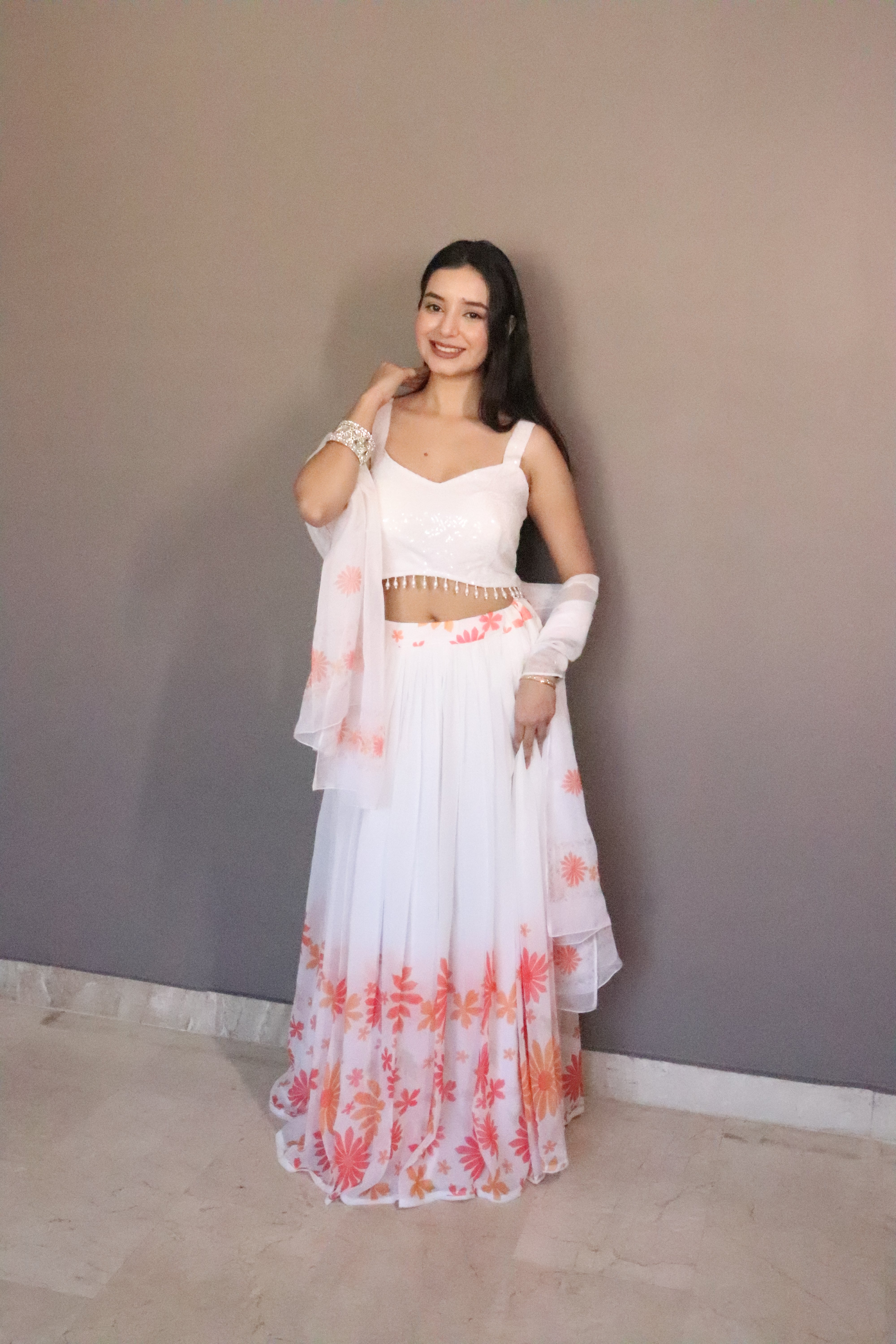 A swirl of white elegance kissed with coral floral magic