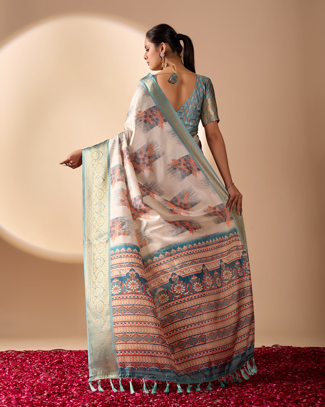 Elegant Soft Lichi Silk Saree in a refined ivory and teal tone, featuring traditional motifs and intricate digital prints enhanced with a golden zari border