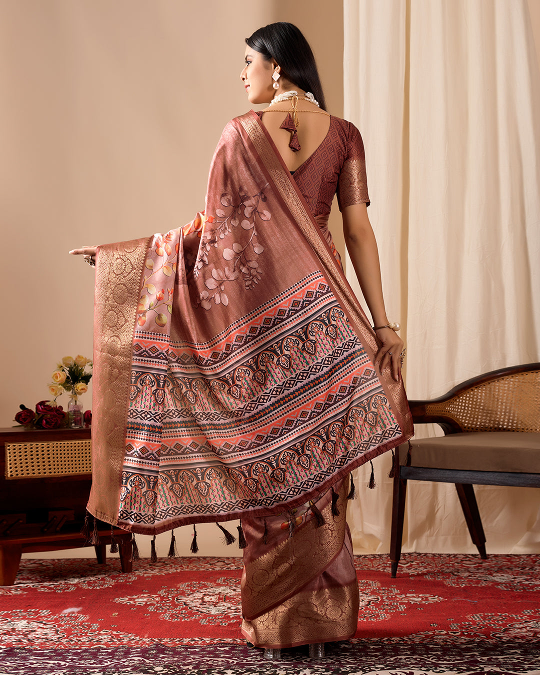 Soft Lichi Silk Saree adorned with graceful Patola-inspired motifs and a rich woven border