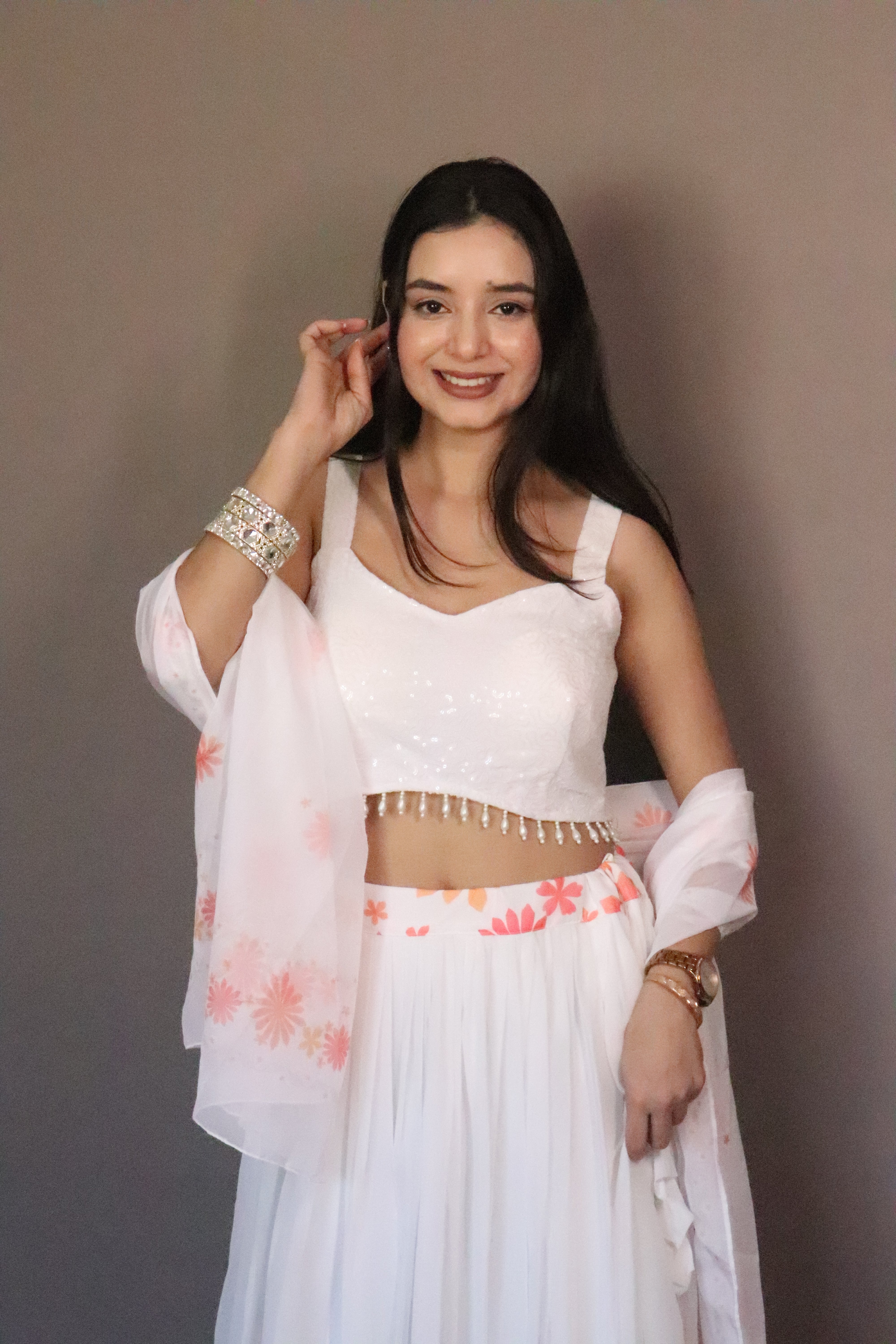 A swirl of white elegance kissed with coral floral magic