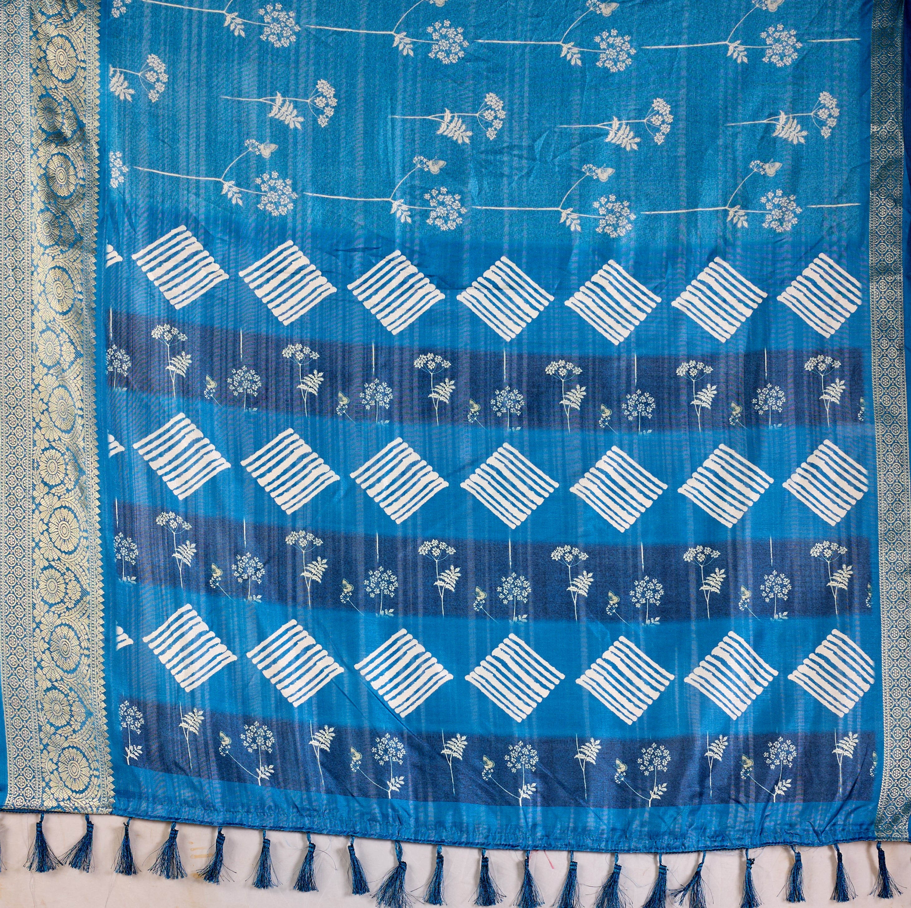 Premium Soft Lichi Silk Saree highlighted with graceful silver zari weaving and intricate ethnic motifs