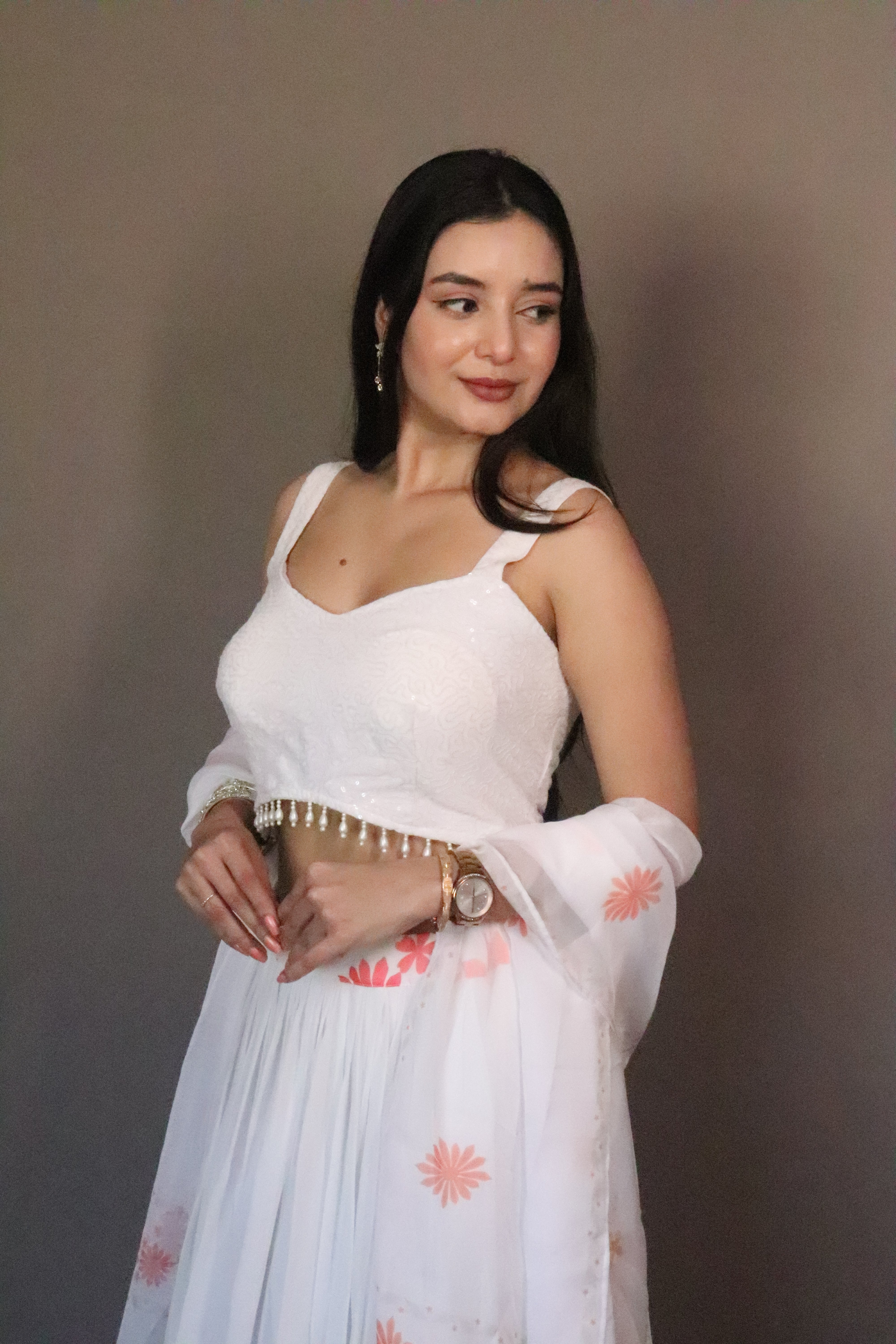 A swirl of white elegance kissed with coral floral magic