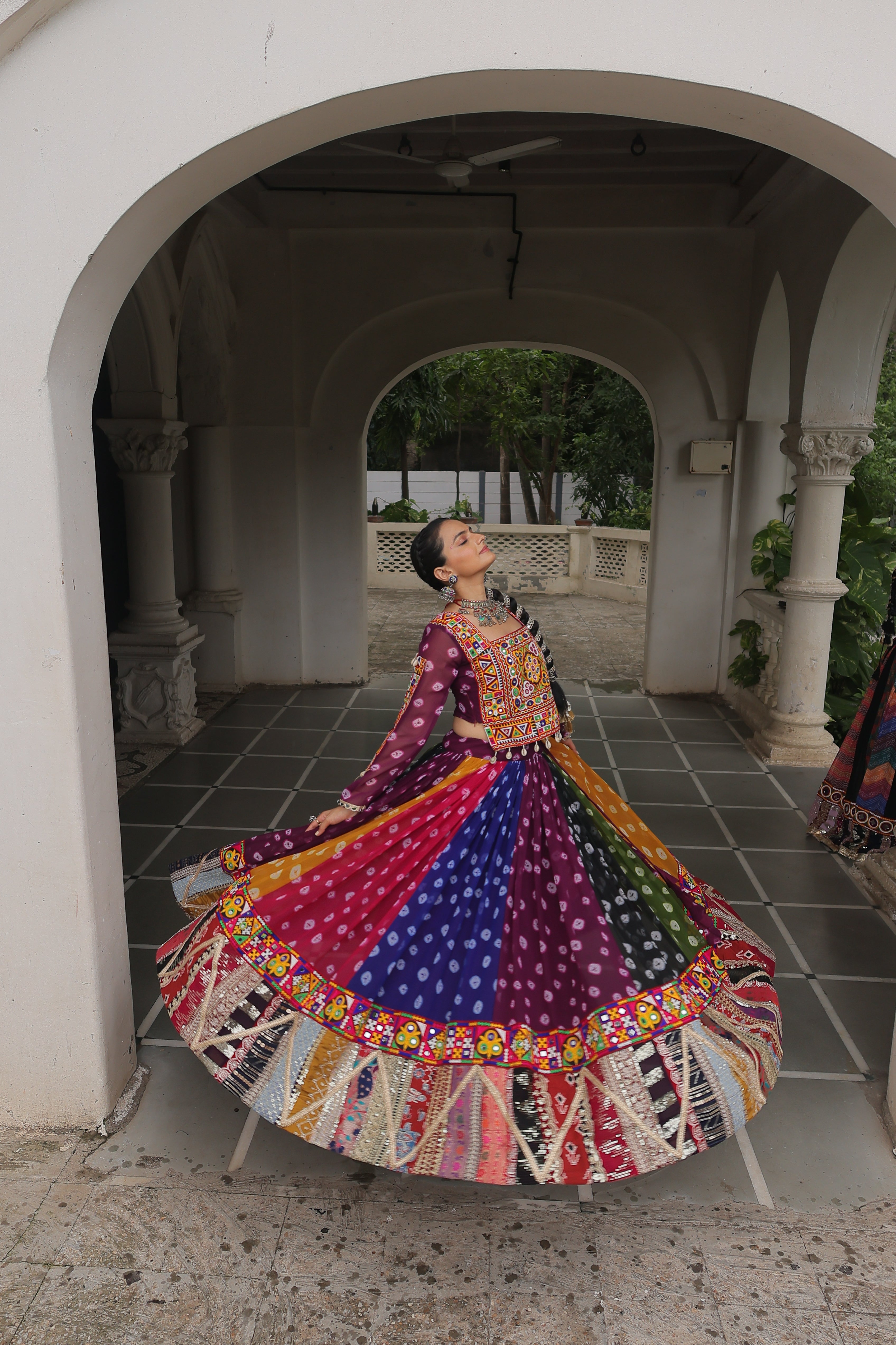 Raangilo Bandhani Mirrorwork Navratna Lehenga