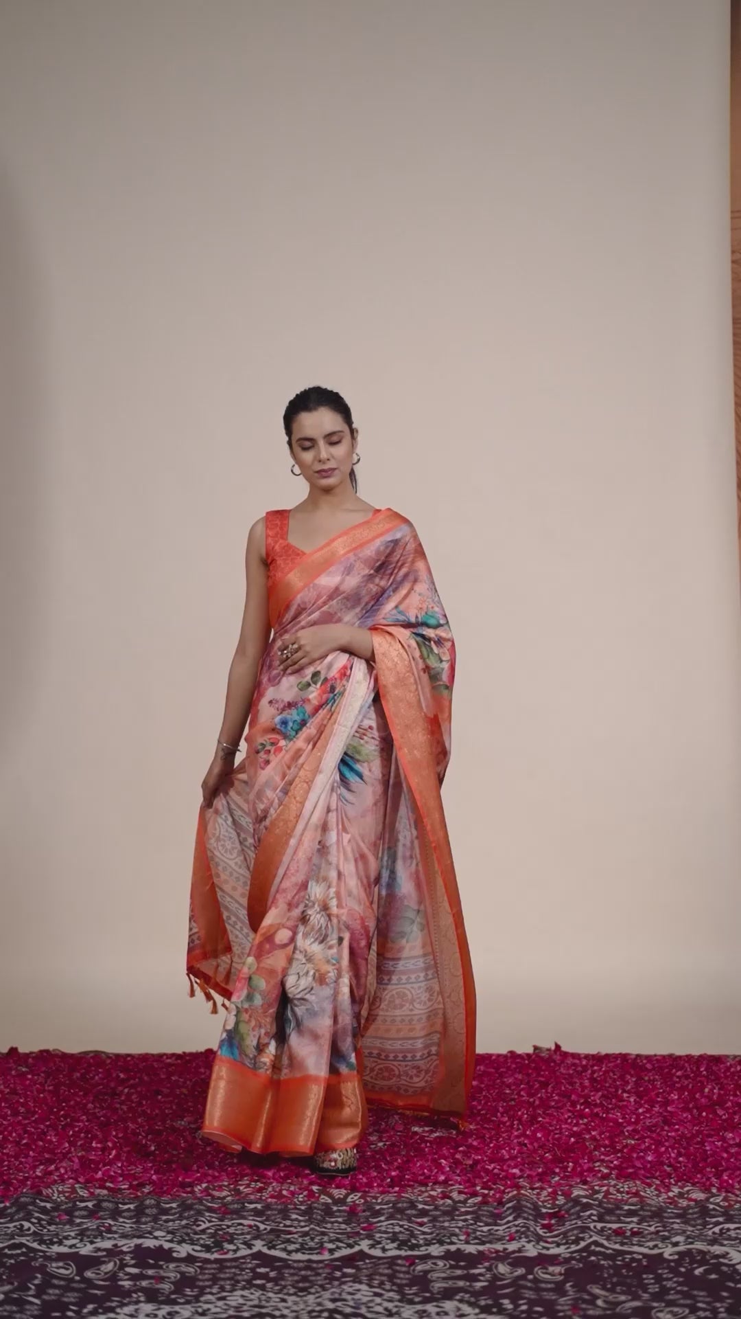 Soft Lichi Silk Saree adorned with elegant floral patterns and intricate Patola-inspired pallu, complemented by a luxurious zari woven border