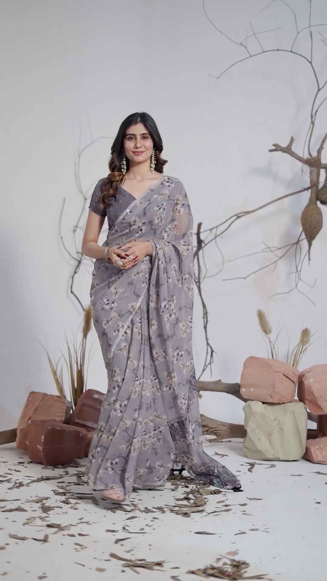 Soft Georgette Saree in Muted Grey Base Adorned with All-Over Floral Digital Print and Enhanced with Ornate Tribal-Style Patterned Pallu Featuring Pink