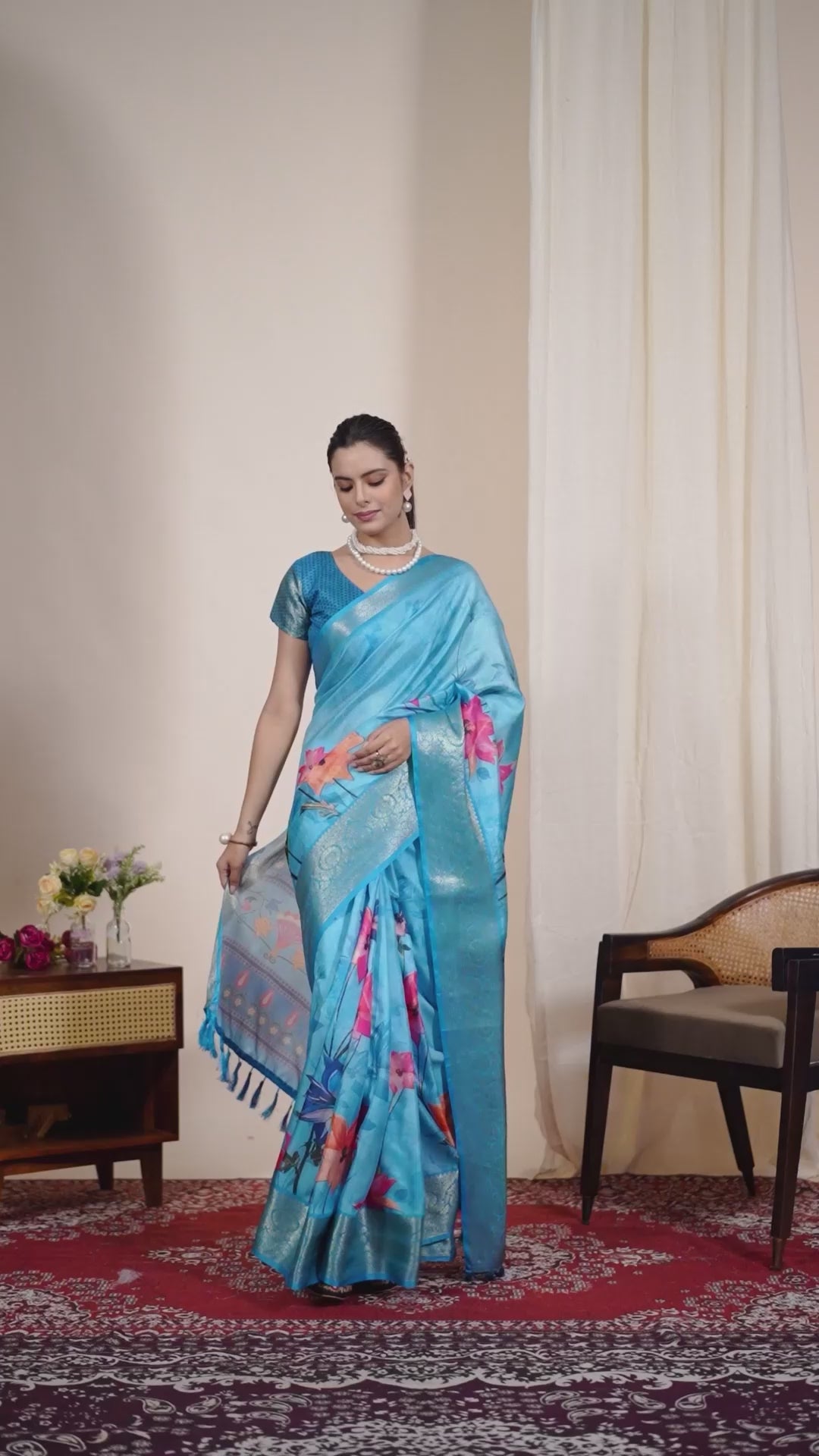 Soft Lichi Silk Saree in Serene Sky Blue Tone adorned with mesmerizing lotus-inspired digital prints and complemented by a luxurious golden zari woven border
